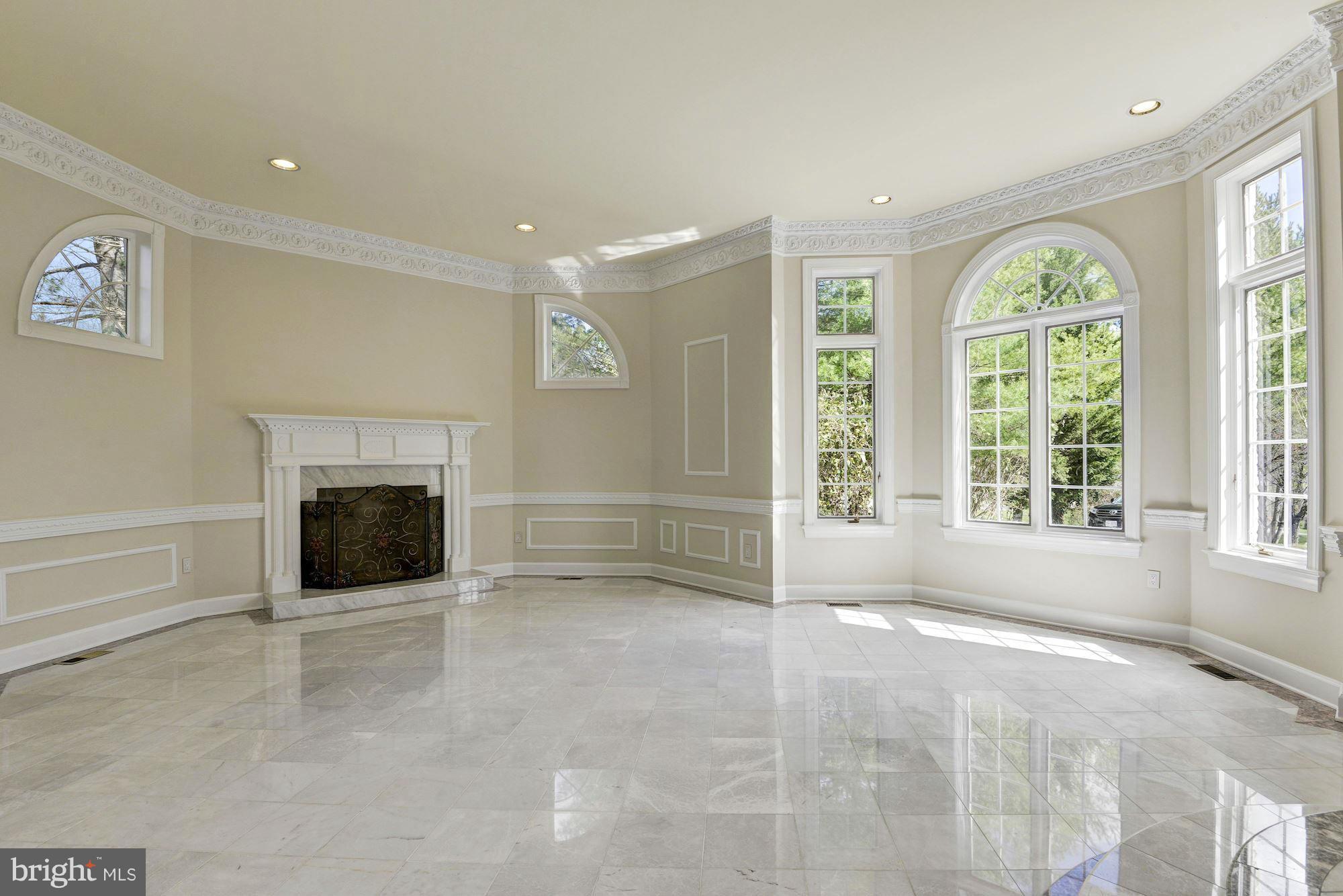 11112 Potomac View Drive Potomac, MD 20854 - Photo 3 of 30 a view of an empty room with a fireplace and a window