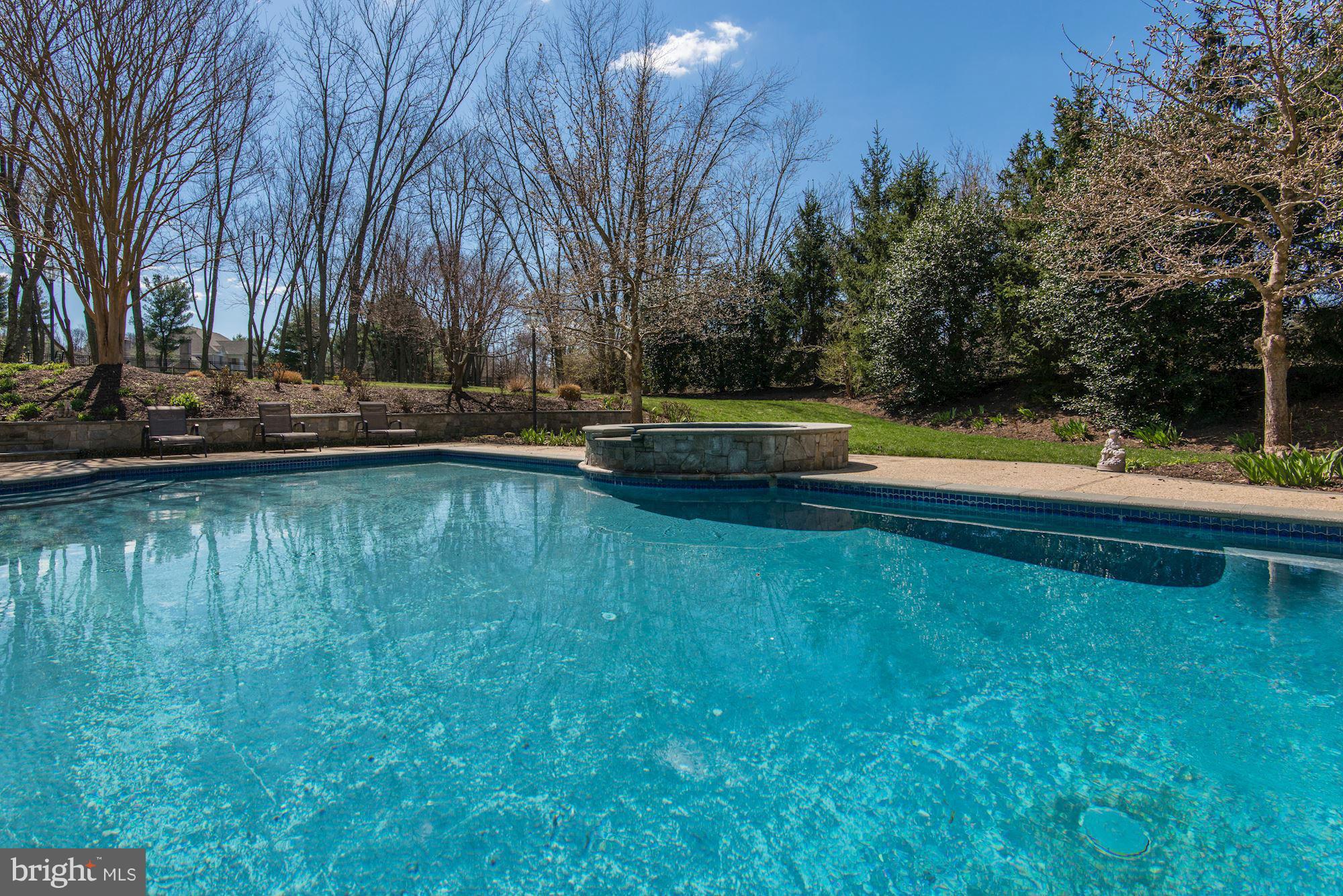 11112 Potomac View Drive Potomac, MD 20854 - Photo 26 of 30 a view of a swimming pool with an outdoor space and seating area