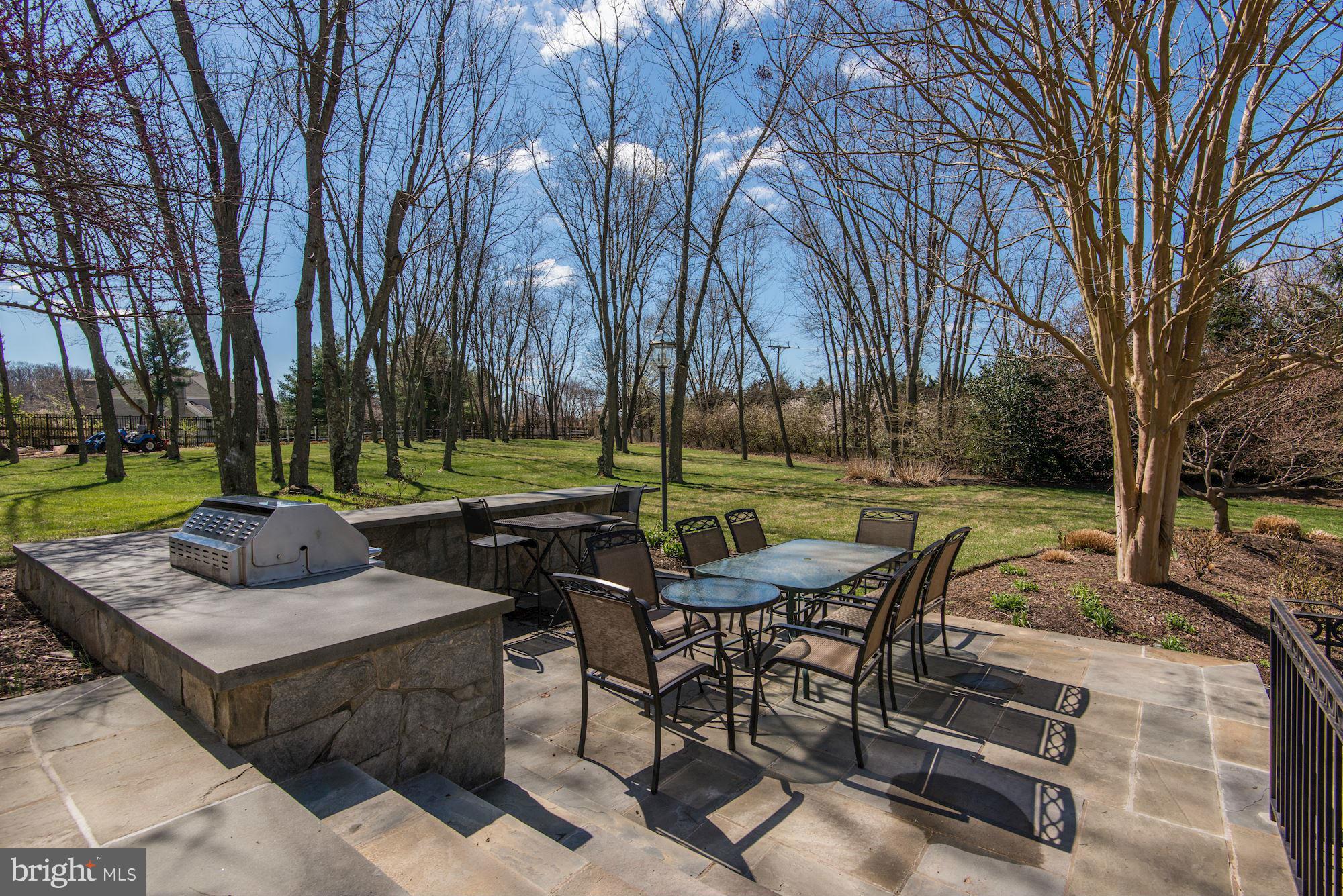 11112 Potomac View Drive Potomac, MD 20854 - Photo 28 of 30 a view of a table and chairs in the patio