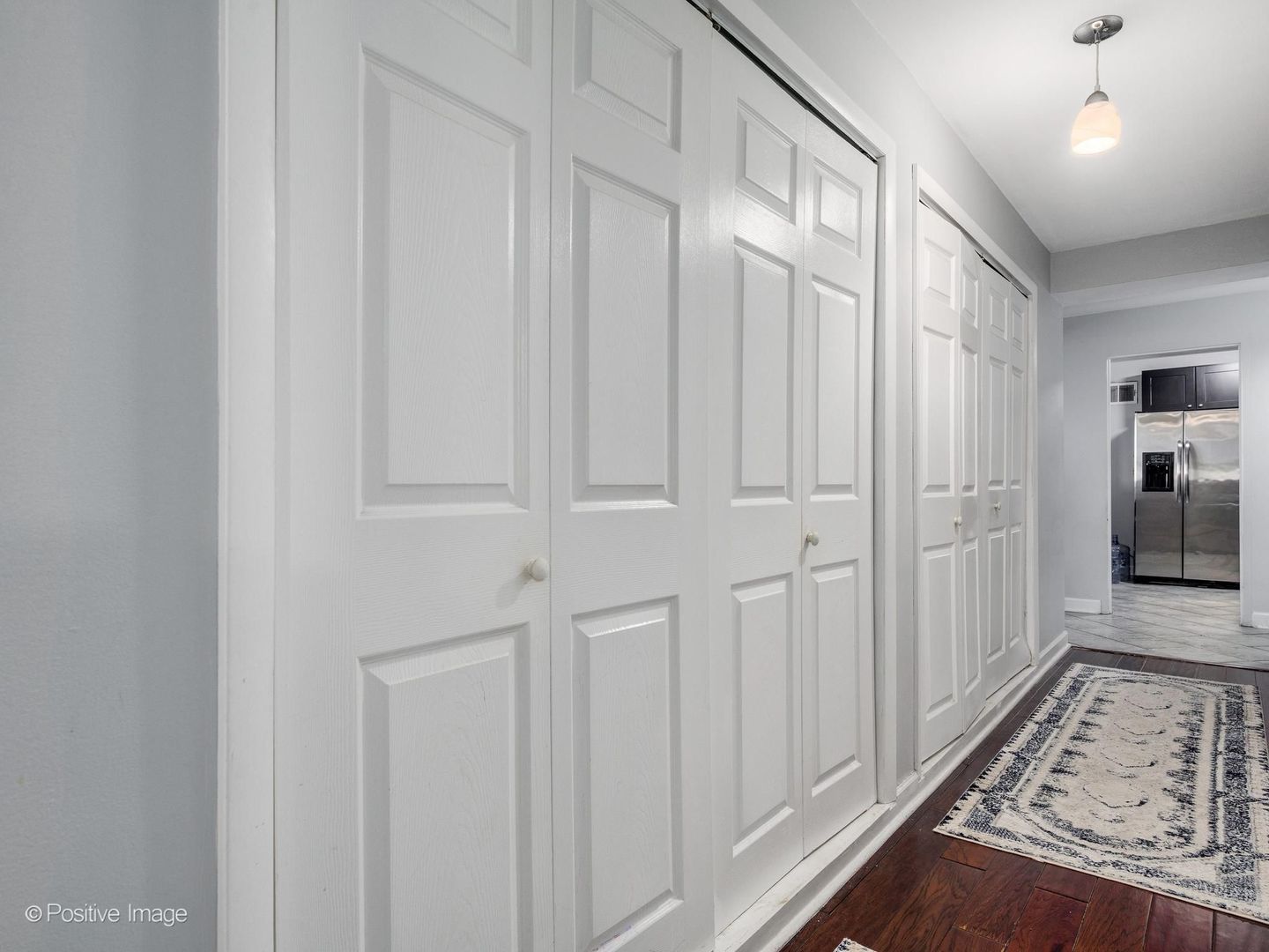 5801 North Sheridan Road, Unit 16B Chicago, IL 60660 - Photo 14 of 23 a view of a hallway with wooden floor and staircase