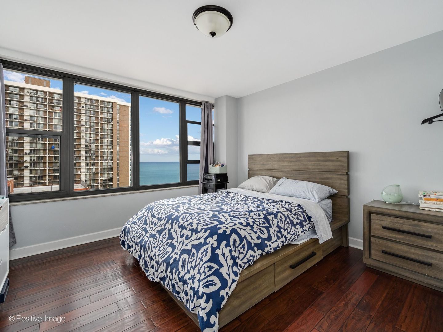 5801 North Sheridan Road, Unit 16B Chicago, IL 60660 - Photo 15 of 23 a bedroom with bed and large window