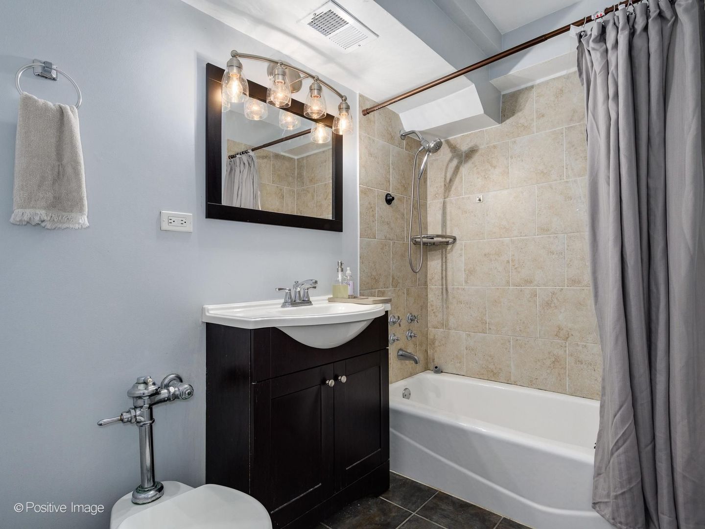 5801 North Sheridan Road, Unit 16B Chicago, IL 60660 - Photo 18 of 23 a bathroom with a sink toilet and shower