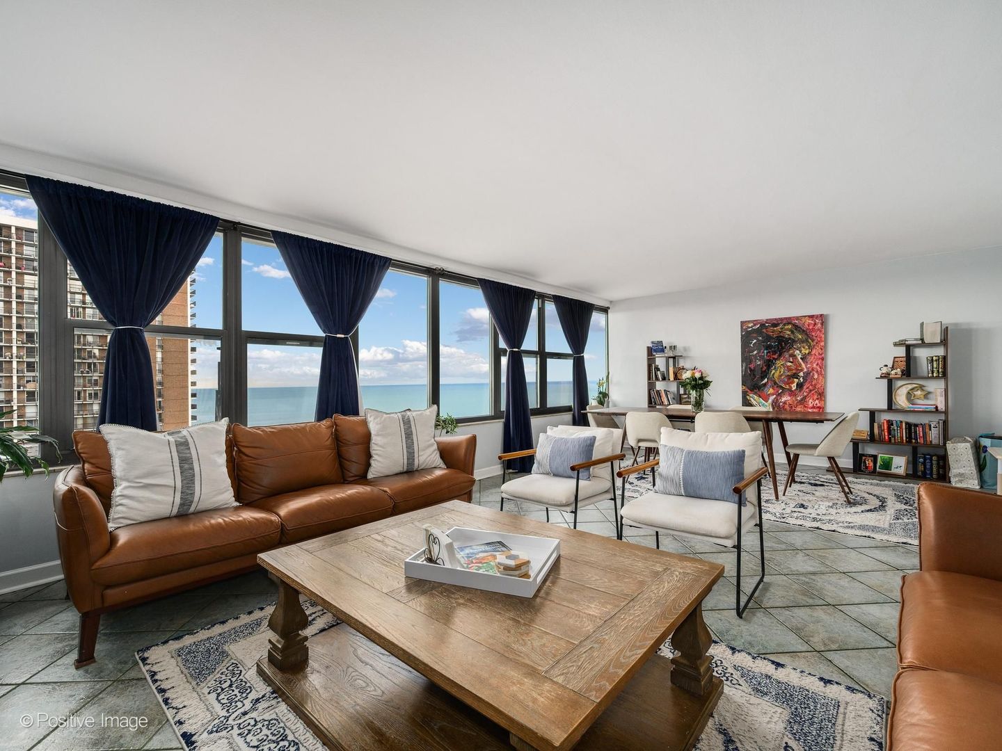 5801 North Sheridan Road, Unit 16B Chicago, IL 60660 - Photo 7 of 23 a living room with furniture and a large window