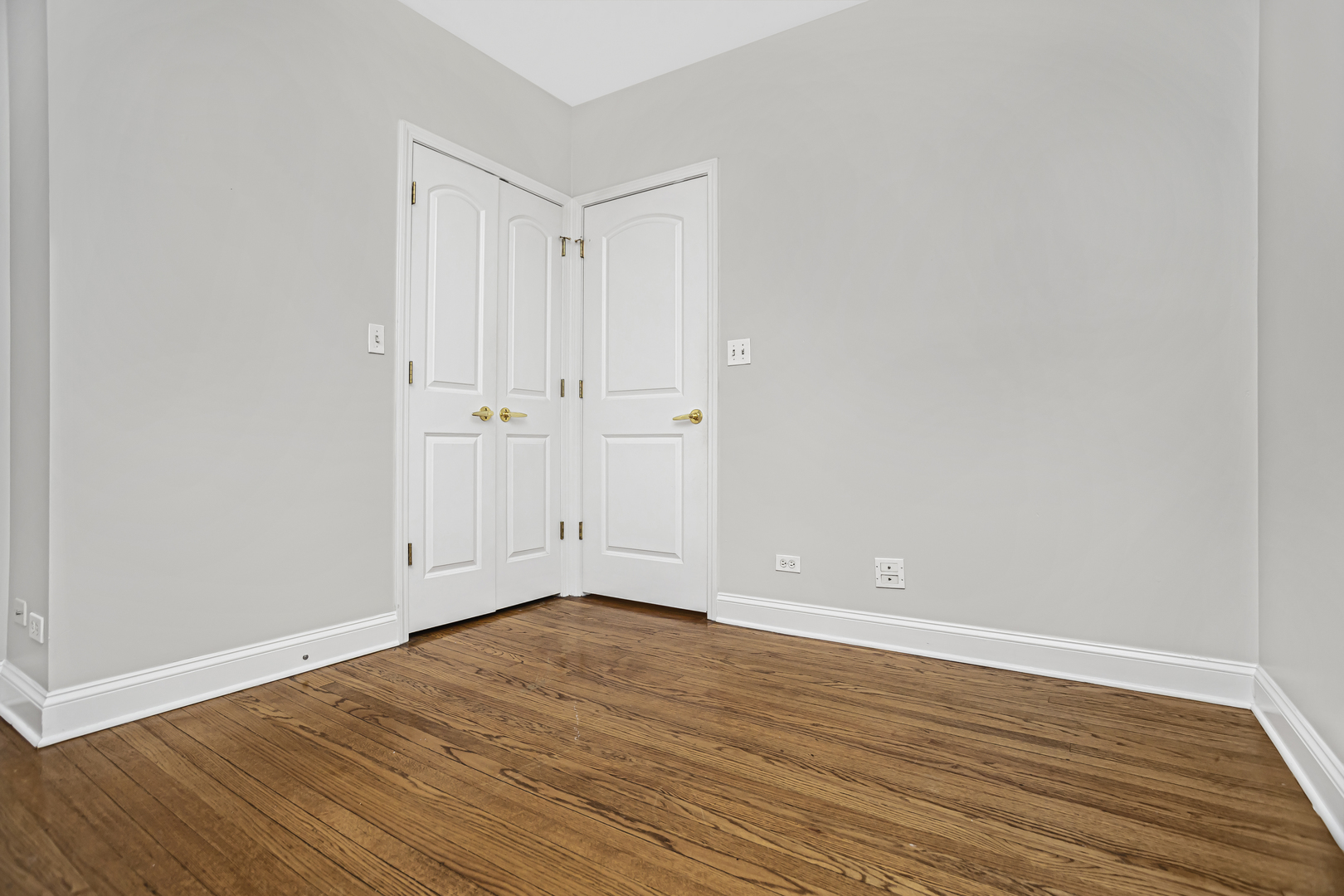1210 West Roscoe Street, Unit 1 Chicago, IL 60657 - Photo 12 of 20 a view of an empty room with wooden floor