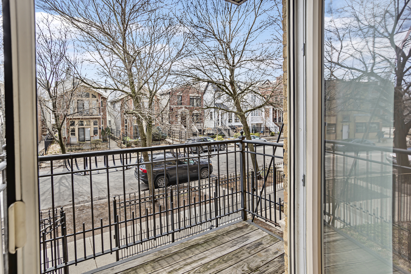 1210 West Roscoe Street, Unit 1 Chicago, IL 60657 - Photo 18 of 20 a view of a balcony with a small yard