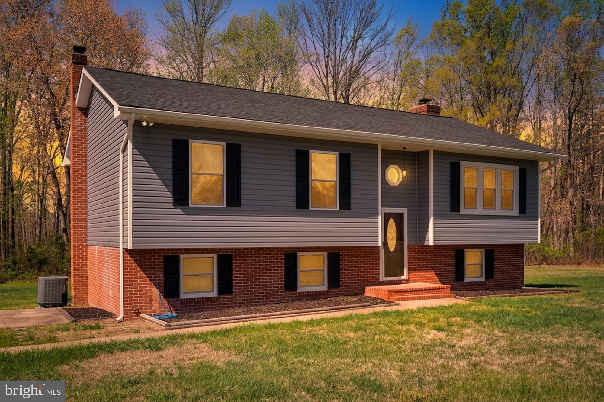 13452 Post Oak Road Spotsylvania, VA 22551 - Photo 1 of 56 a front view of a house with a yard