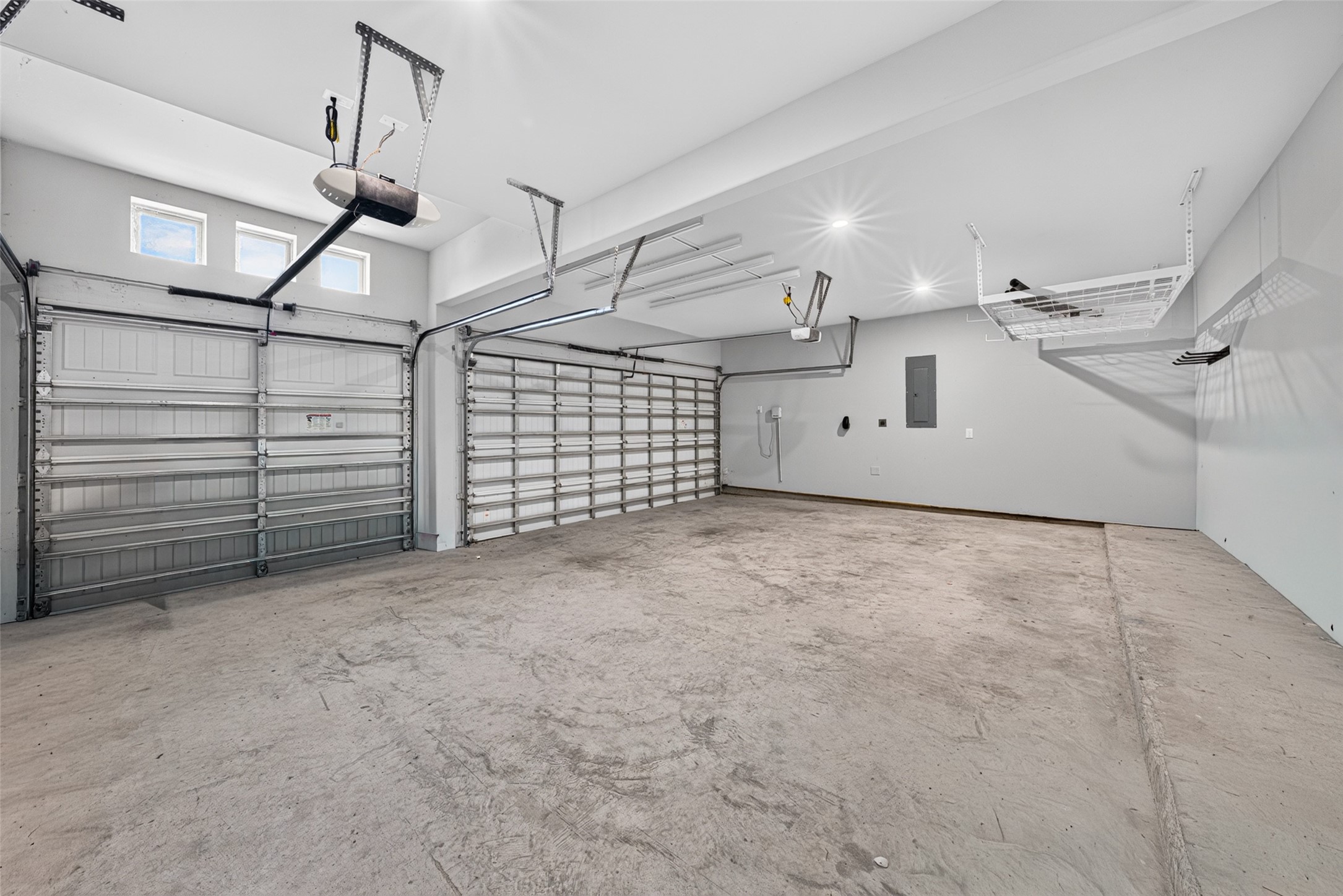 4207 Ana Ridge Lane Fulshear, TX 77441 - Photo 31 of 37 Oversized garage featuring an abundance of space for vehicles, workbenches, or outdoor gear storage!