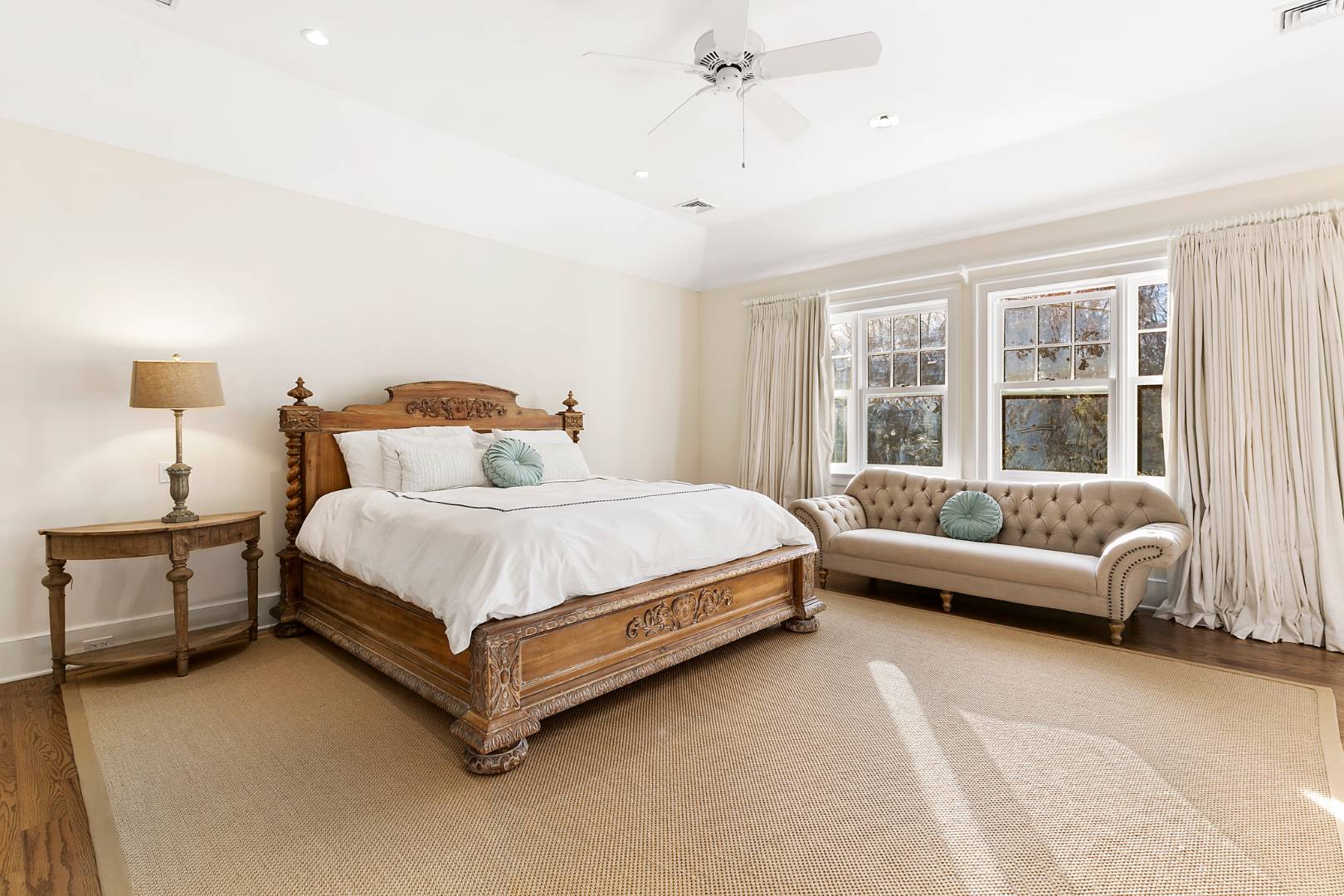 22 Gardiners Path Sag Harbor, NY 11963 - Photo 10 of 13 a bedroom with a bed couch and windows