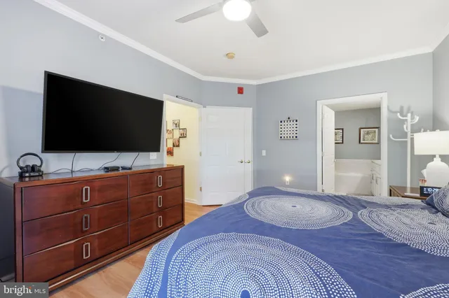 a bathroom with a tub a sink and mirror
