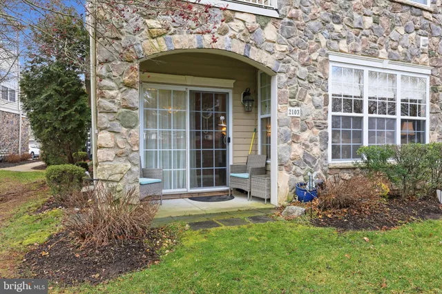 a view of a field with trees in the background