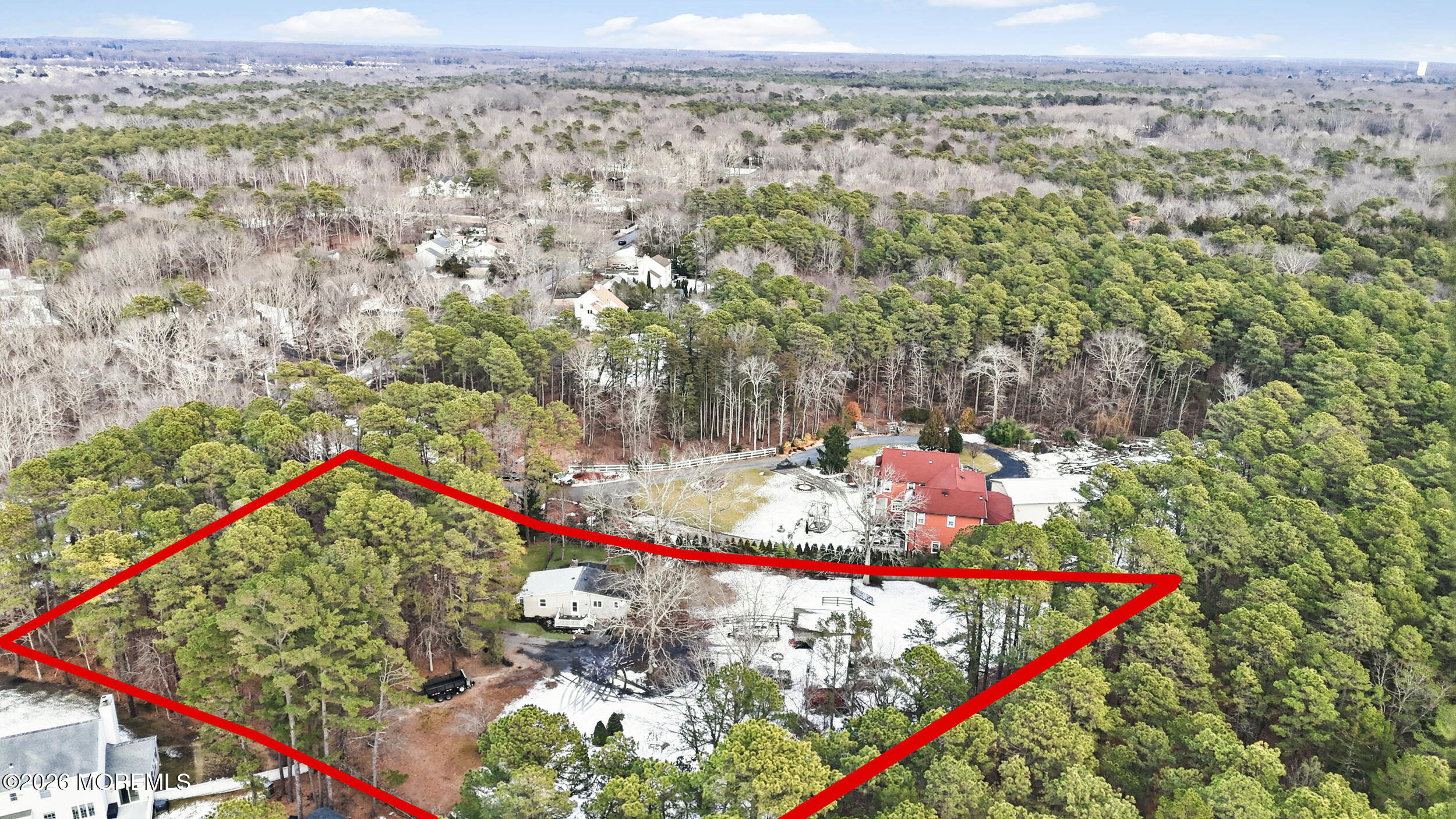283 East Pleasant Grove Road Jackson, NJ 08527 - Photo 8 of 10 an aerial view of a houses with a lush green hillside