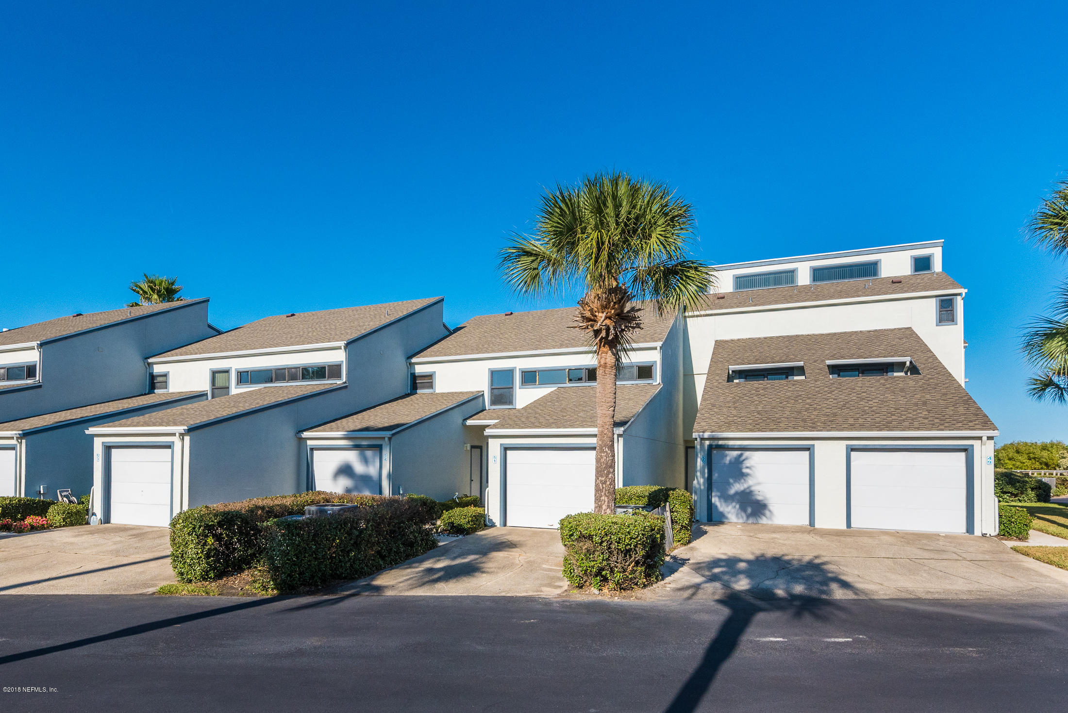 890 A1A Beach Boulevard, Unit 50 St. Augustine, FL 32080 - Photo 2 of 71 a front view of a house with a yard