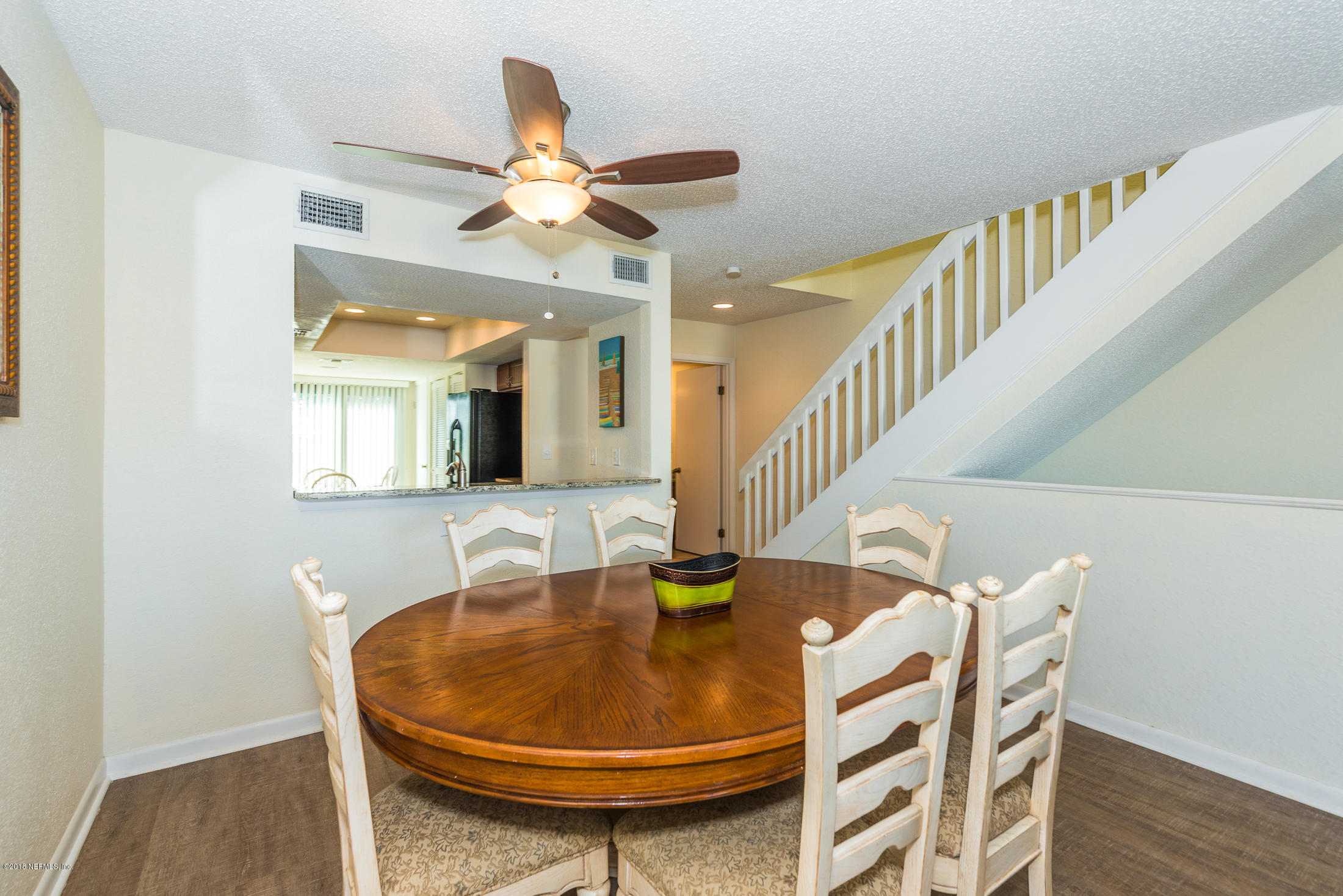 890 A1A Beach Boulevard, Unit 50 St. Augustine, FL 32080 - Photo 21 of 71 a view of a dining room with furniture and wooden floor