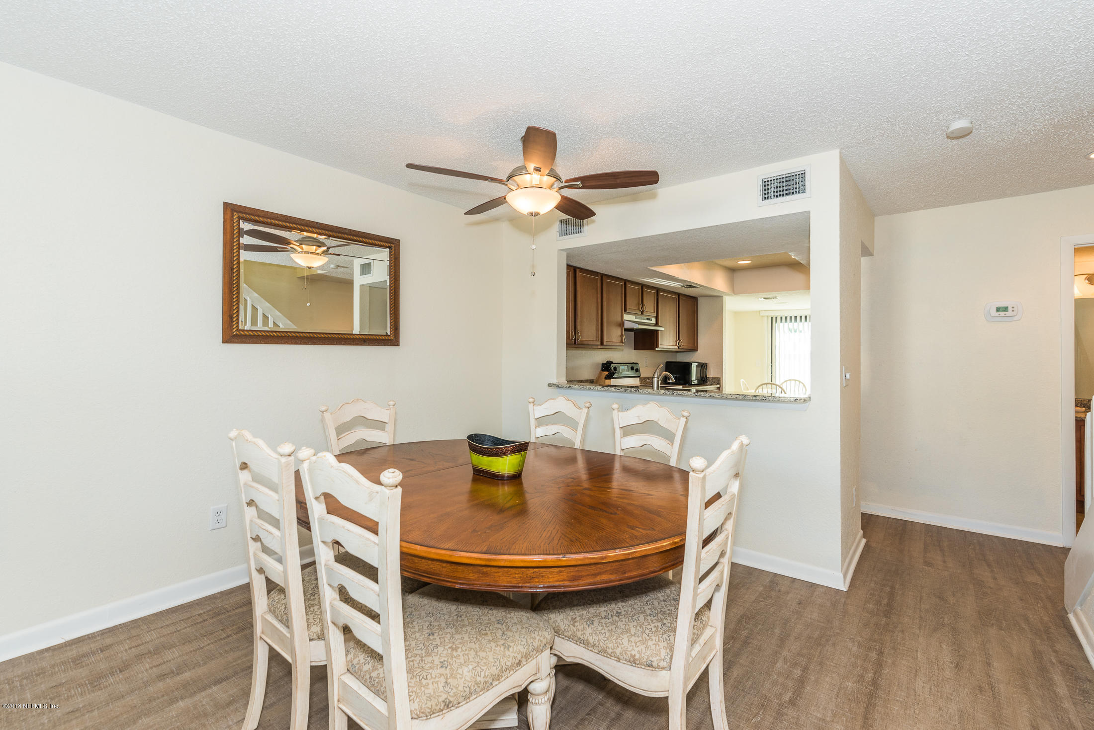 890 A1A Beach Boulevard, Unit 50 St. Augustine, FL 32080 - Photo 22 of 71 a dining room with furniture and chandelier