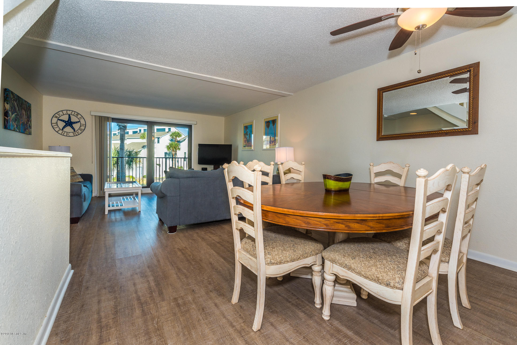 890 A1A Beach Boulevard, Unit 50 St. Augustine, FL 32080 - Photo 30 of 71 a dining room with furniture and wooden floor