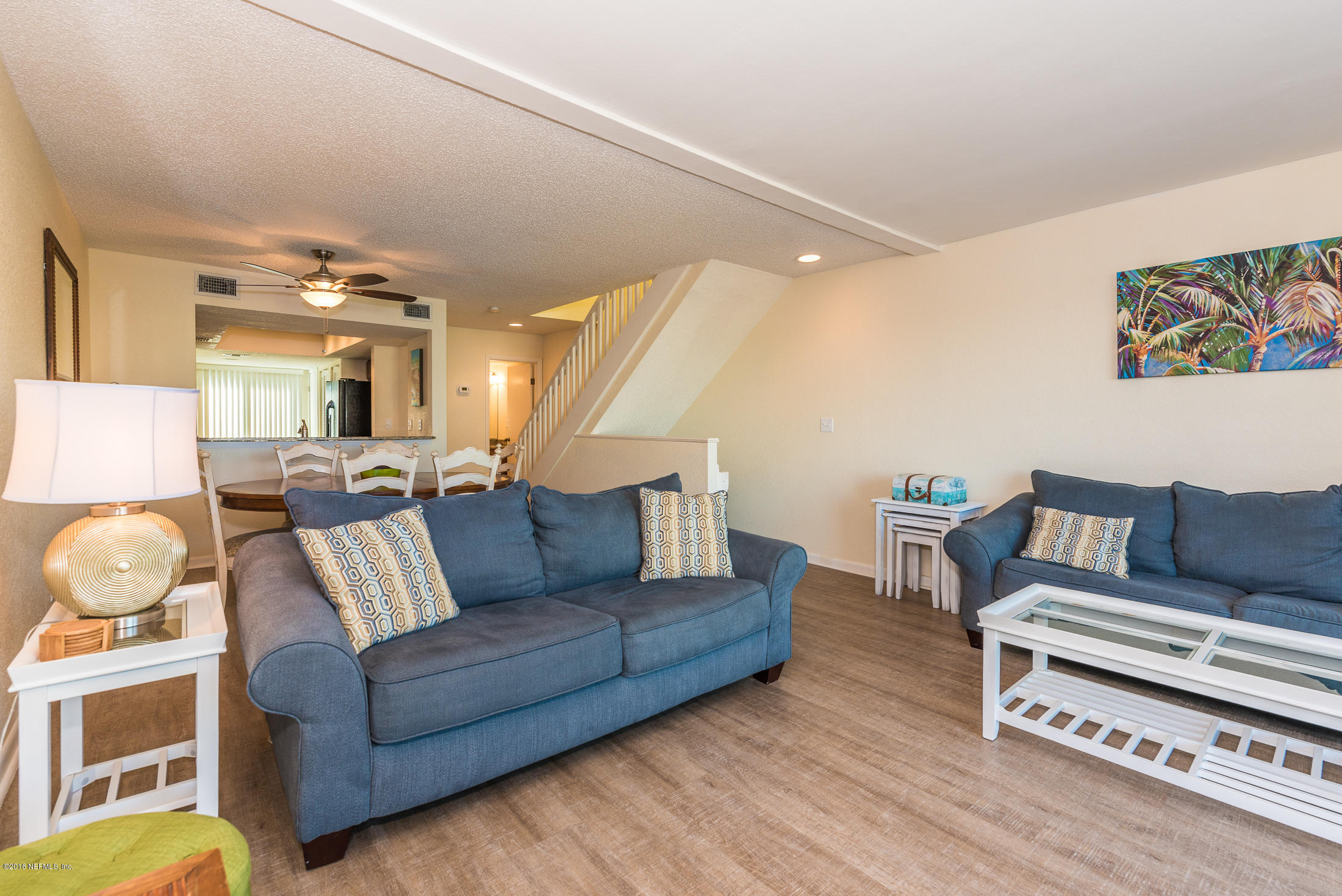 890 A1A Beach Boulevard, Unit 50 St. Augustine, FL 32080 - Photo 34 of 71 a living room with furniture and a wooden floor