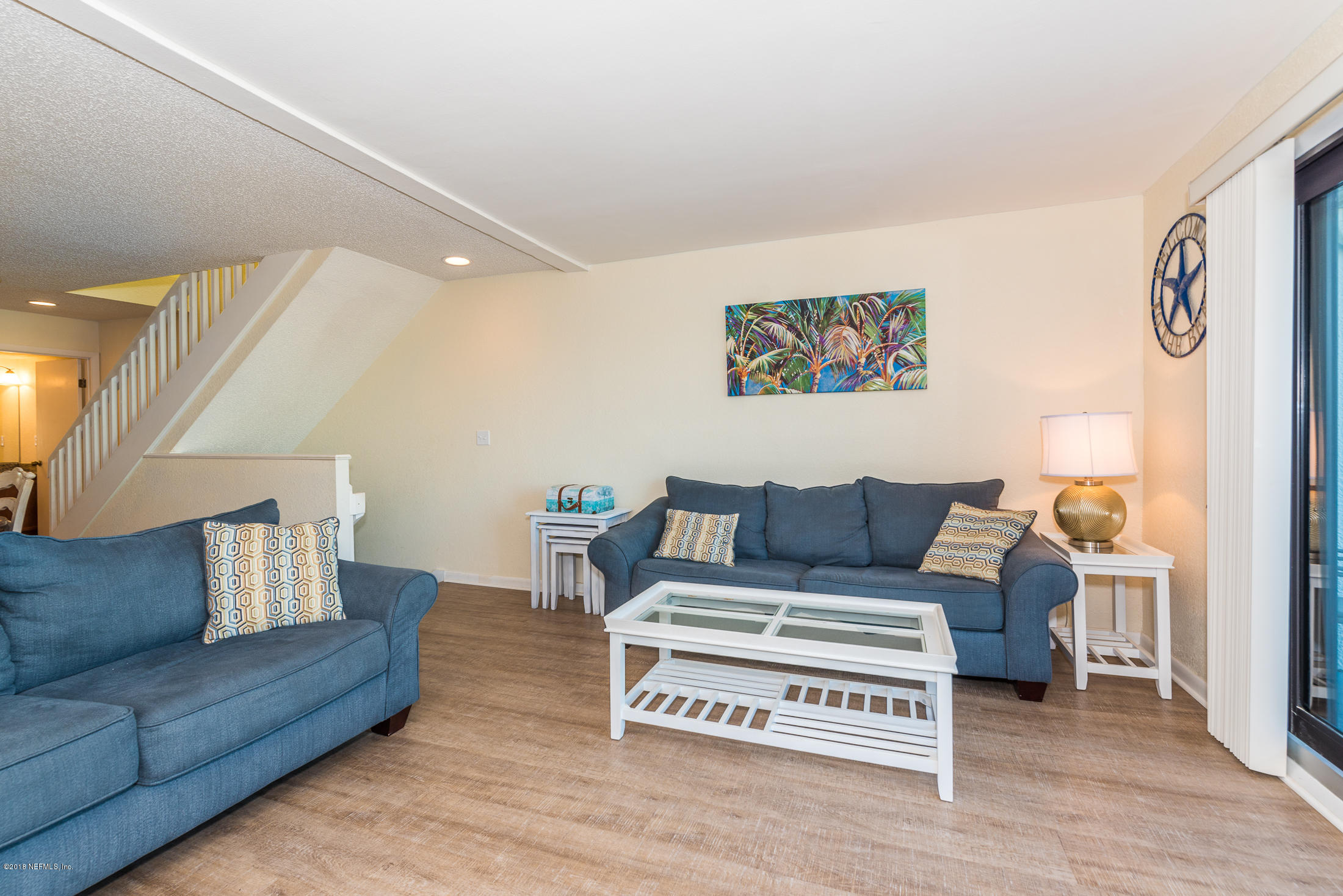 890 A1A Beach Boulevard, Unit 50 St. Augustine, FL 32080 - Photo 35 of 71 a living room with furniture and wooden floor