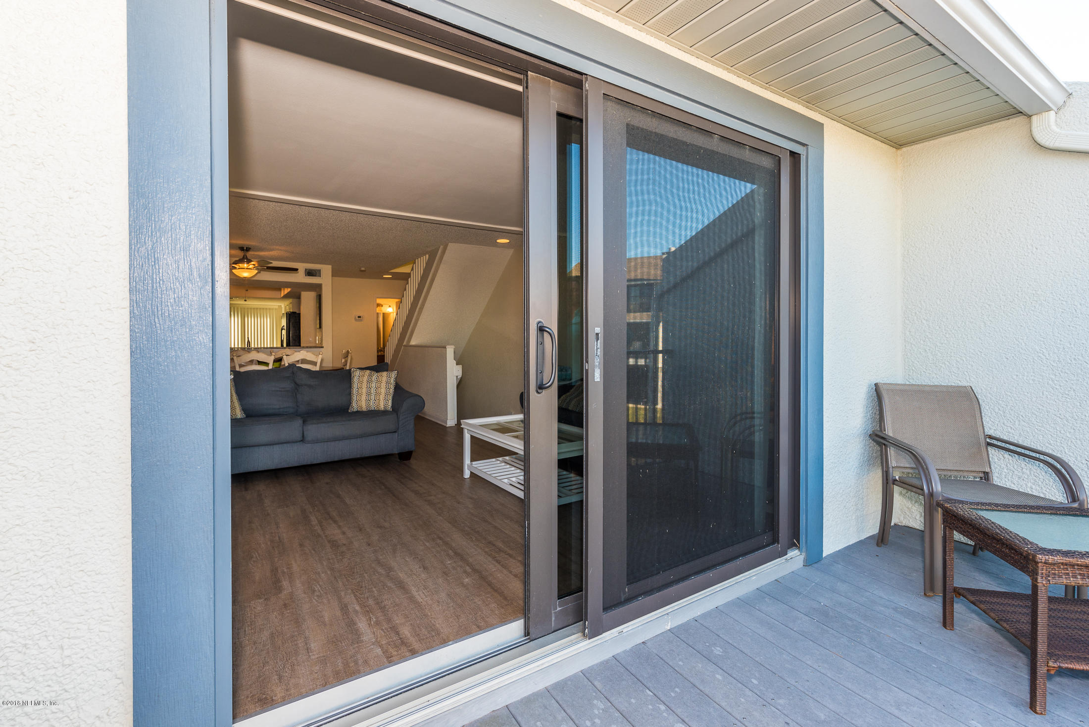 890 A1A Beach Boulevard, Unit 50 St. Augustine, FL 32080 - Photo 39 of 71 a view of a livingroom with furniture and a hallway