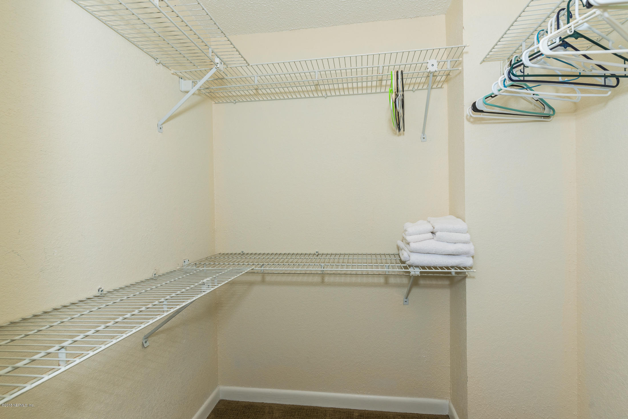 890 A1A Beach Boulevard, Unit 50 St. Augustine, FL 32080 - Photo 50 of 71 a view of a room with racks on the wall