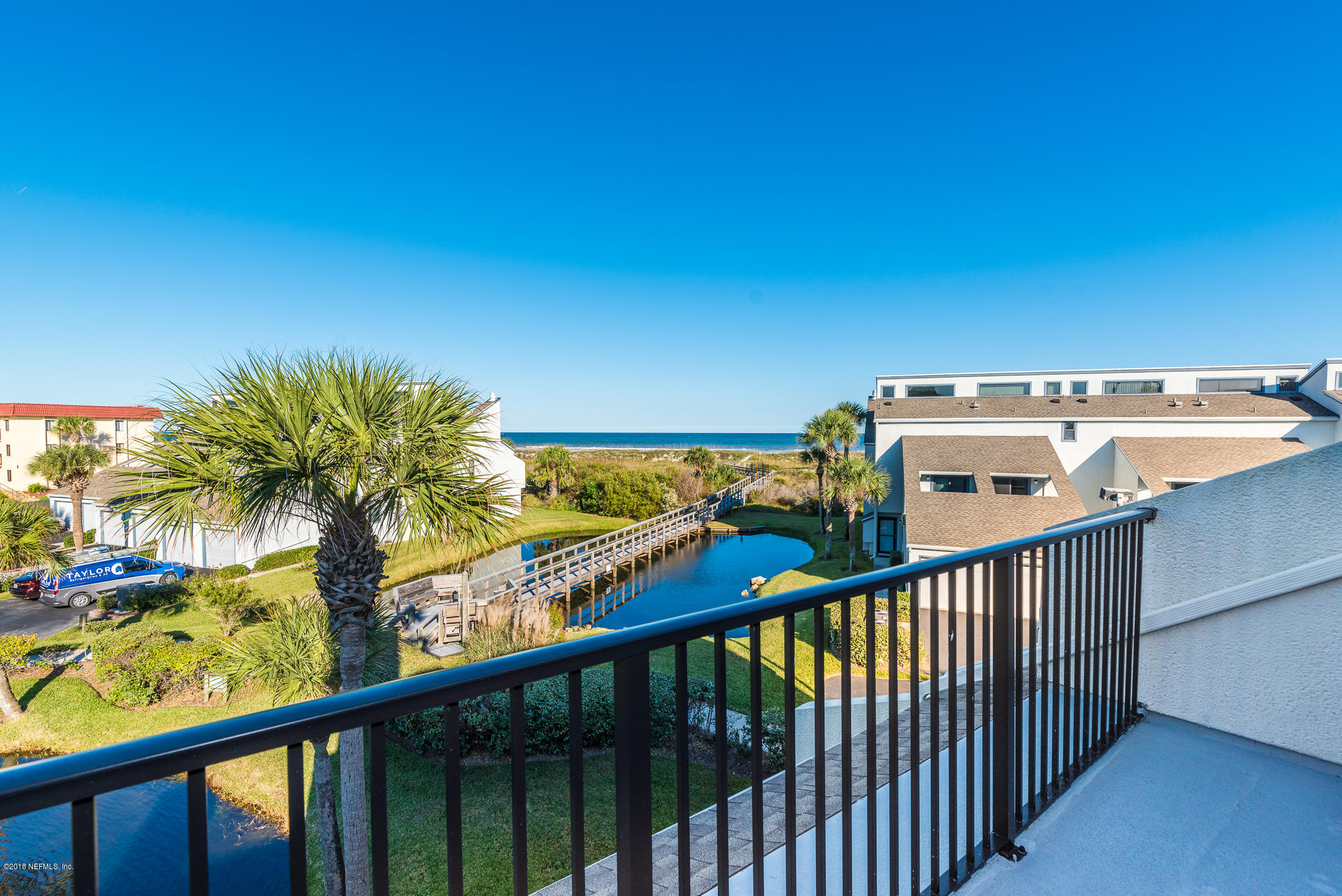 890 A1A Beach Boulevard, Unit 50 St. Augustine, FL 32080 - Photo 53 of 71 a view of a balcony with wooden floor and a table