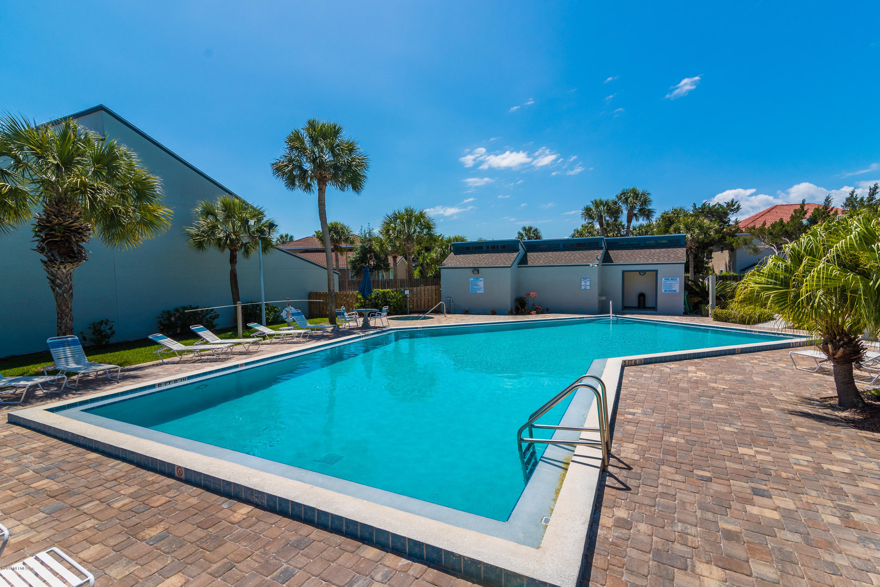 890 A1A Beach Boulevard, Unit 50 St. Augustine, FL 32080 - Photo 63 of 71 a view of a swimming pool with a lounge chairs