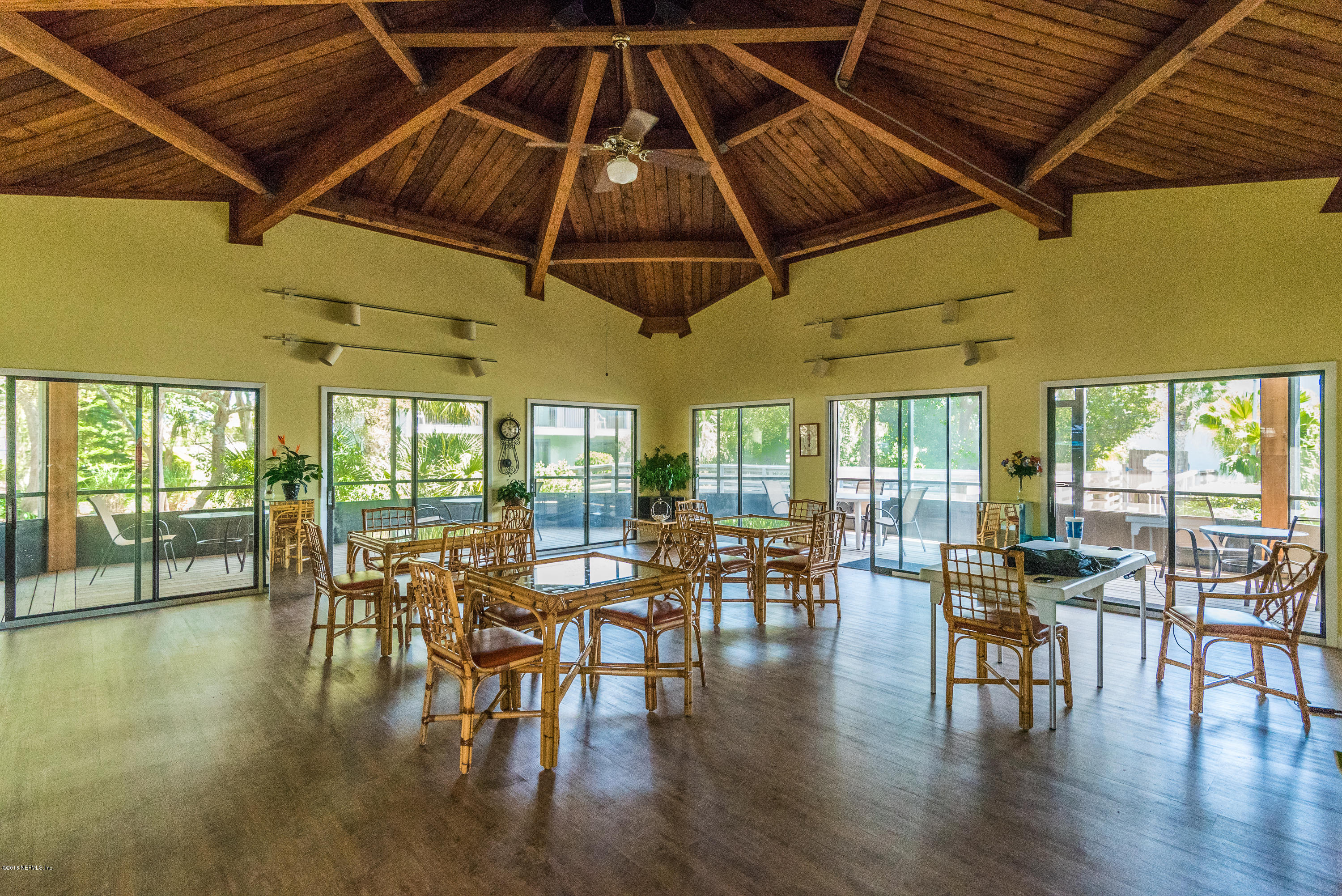 890 A1A Beach Boulevard, Unit 50 St. Augustine, FL 32080 - Photo 67 of 71 a dining room with furniture window and wooden floor