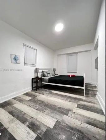 a living room with furniture a ceiling fan and a rug
