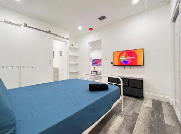 a room with furniture and a flat screen tv
