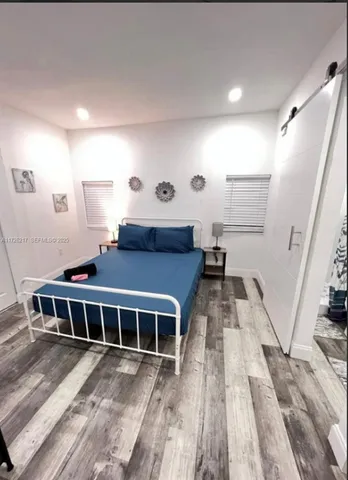 a view of a house with wooden floor and furniture