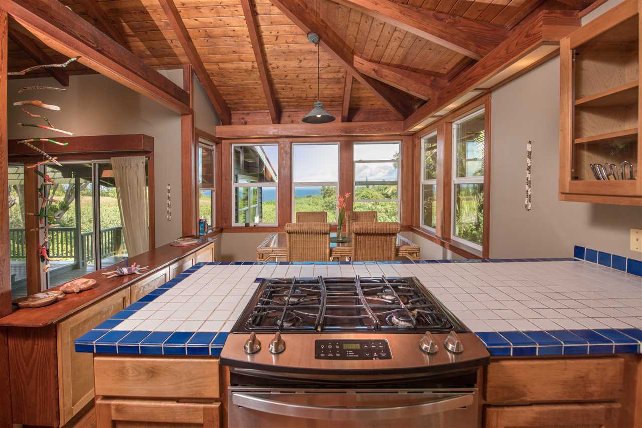 101 West Waipio Road Haiku, HI 96708 - Photo 12 of 30 a bedroom with a large bed and a large window