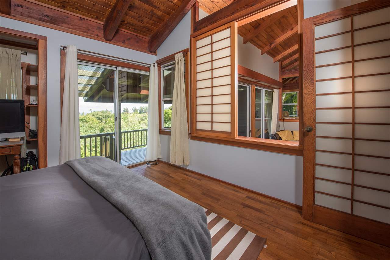 101 West Waipio Road Haiku, HI 96708 - Photo 16 of 30 a view of a bedroom with a balcony