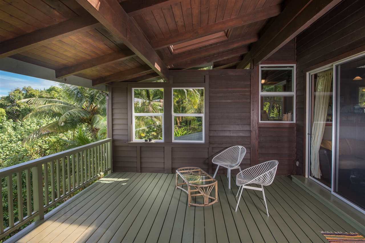 101 West Waipio Road Haiku, HI 96708 - Photo 7 of 30 a view of a porch with furniture and a yard