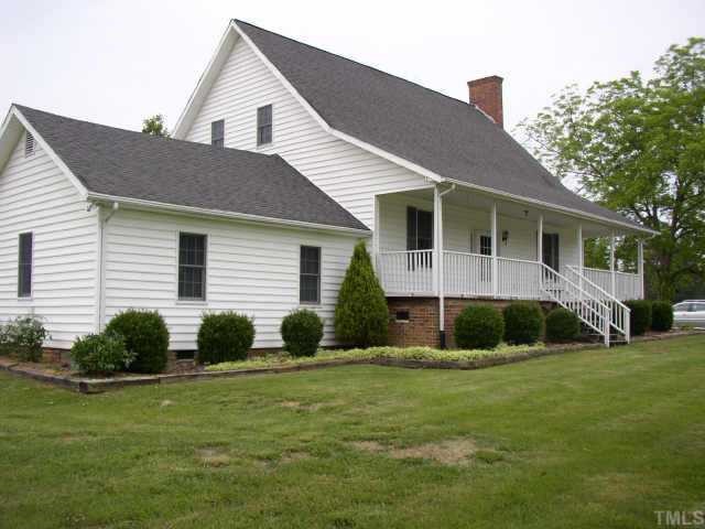 416 Charlie Moore Road Timberlake, NC 27583 - Photo 1 of 1 a view of a house with a yard and plants
