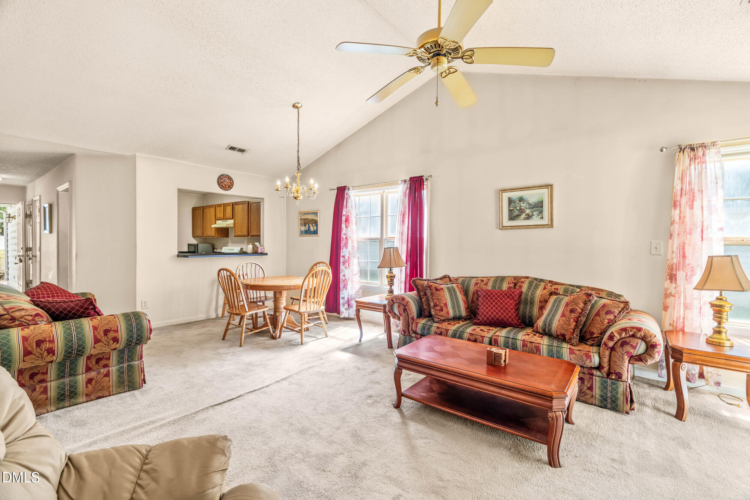 6010 Newhall Road Durham, NC 27713 - Photo 5 of 21 a living room with furniture ceiling fan and a window
