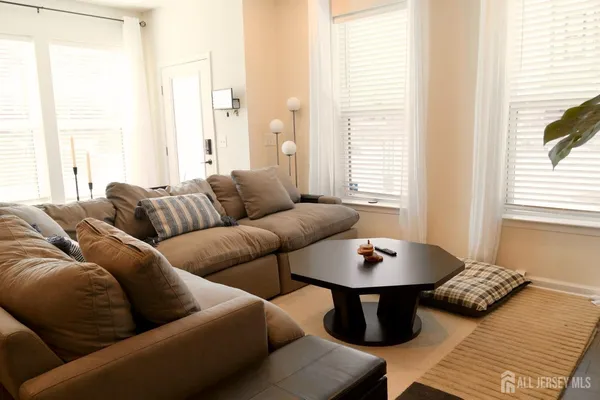 a living room with furniture and a window