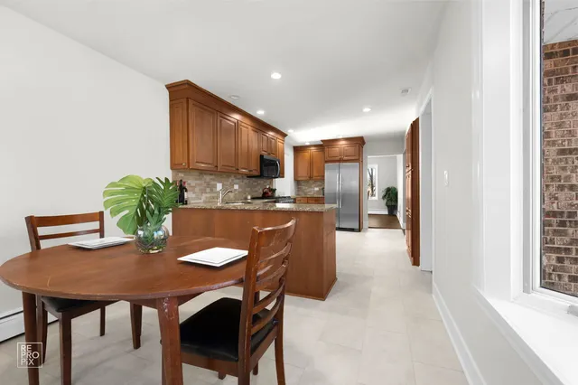 a kitchen with a table and chairs
