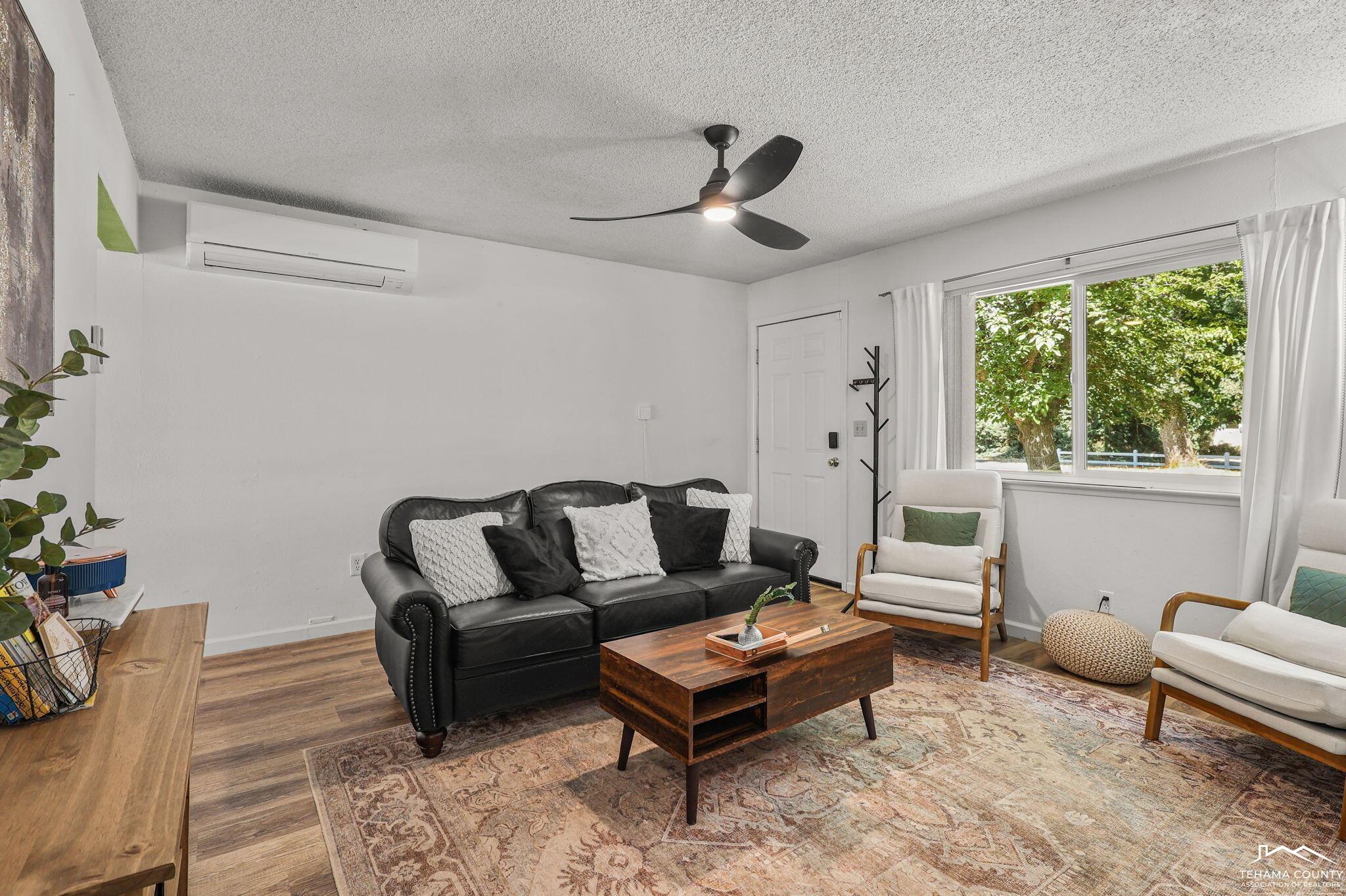 22275 Brent Road Red Bluff, CA 96080 - Photo 8 of 47 a living room with furniture and a large window