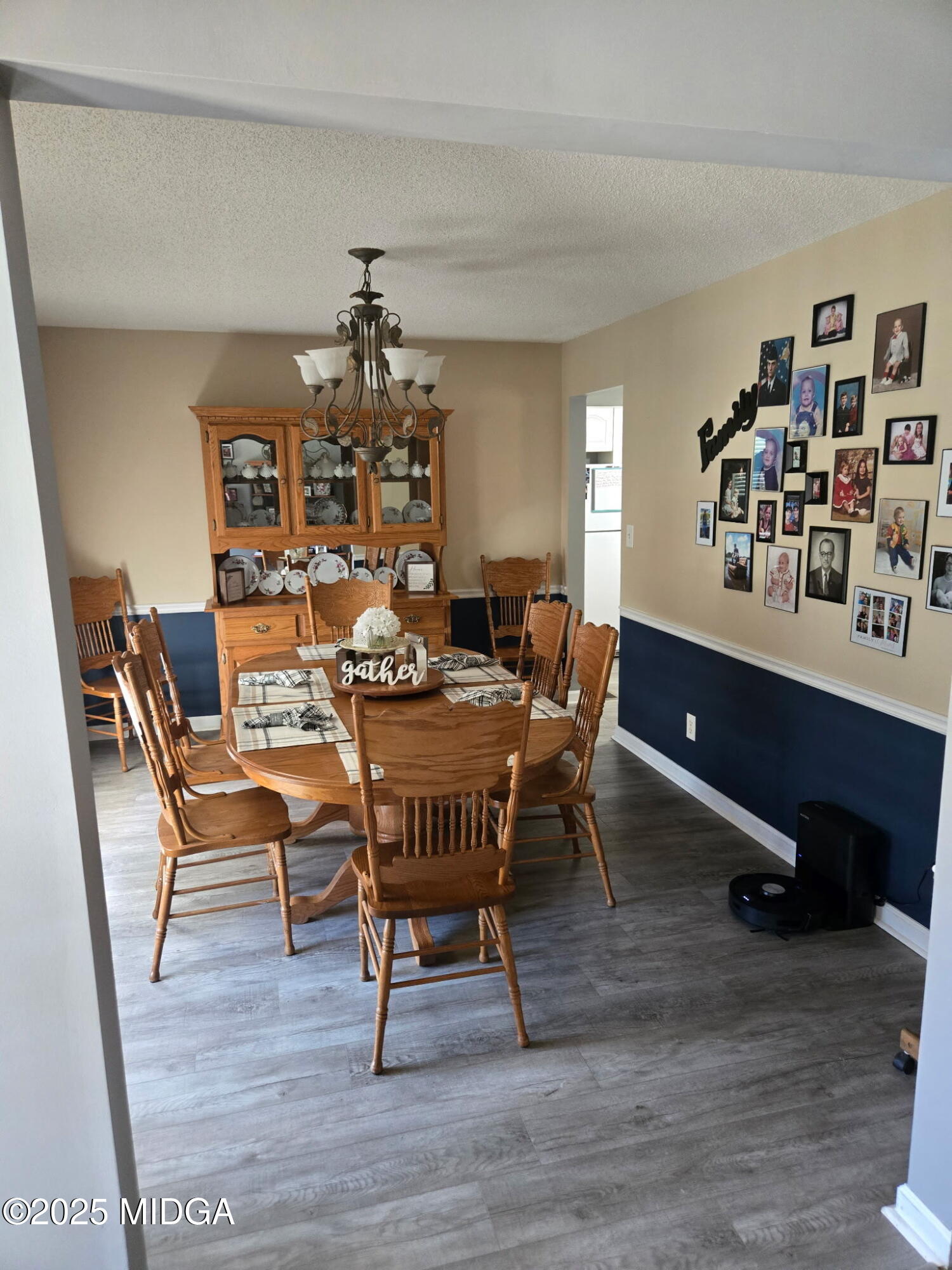 254 Crestview Lane Gray, GA 31032 - Photo 12 of 15 a dining room with furniture a chandelier and wooden floor