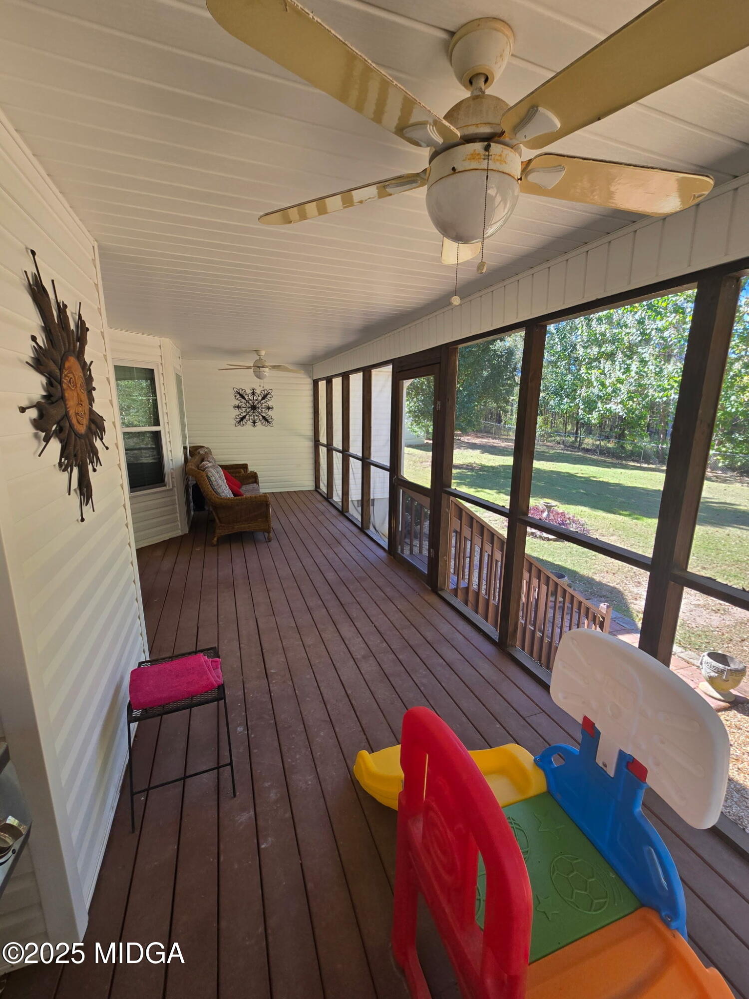 254 Crestview Lane Gray, GA 31032 - Photo 14 of 15 a living room with furniture floor to ceiling window and a wooden floor