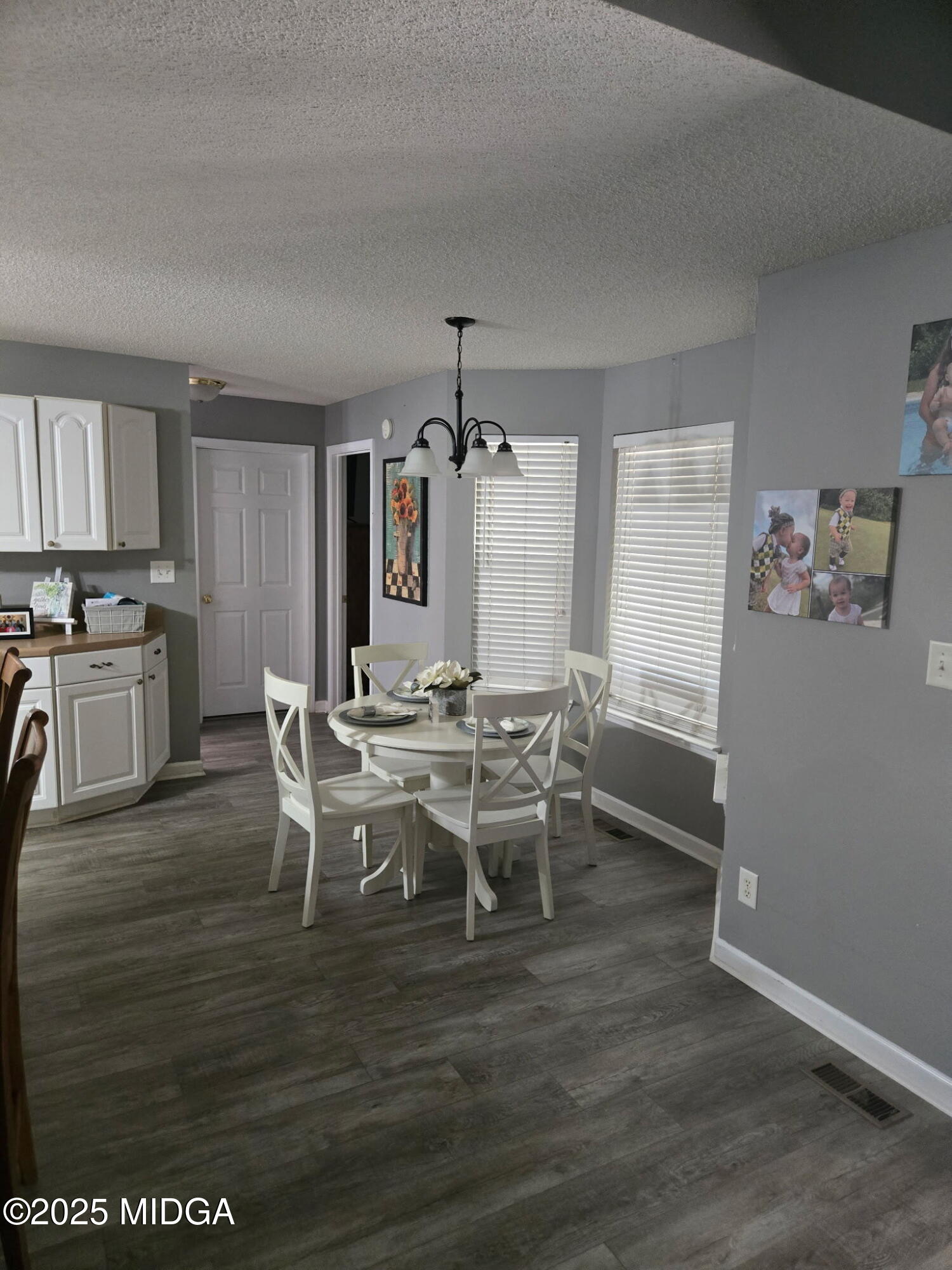 254 Crestview Lane Gray, GA 31032 - Photo 10 of 15 a view of a dining room with furniture and wooden floor