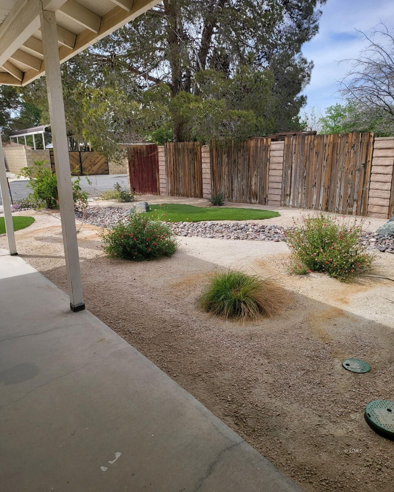 208 South Orchard Street Ridgecrest, CA 93555 - Photo 3 of 26 a front view of a house with garden