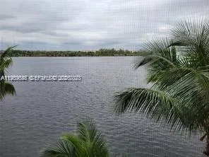 a view of a swimming pool with a lawn chairs