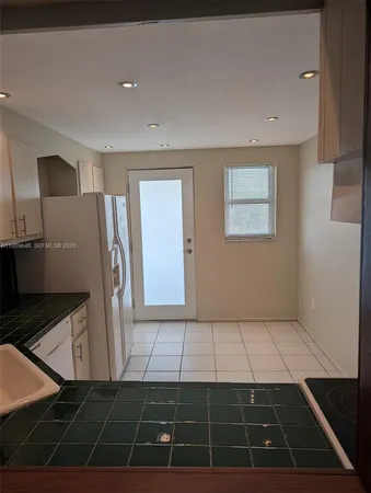 a view of a livingroom with kitchen