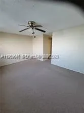 a view of a living room with a large window