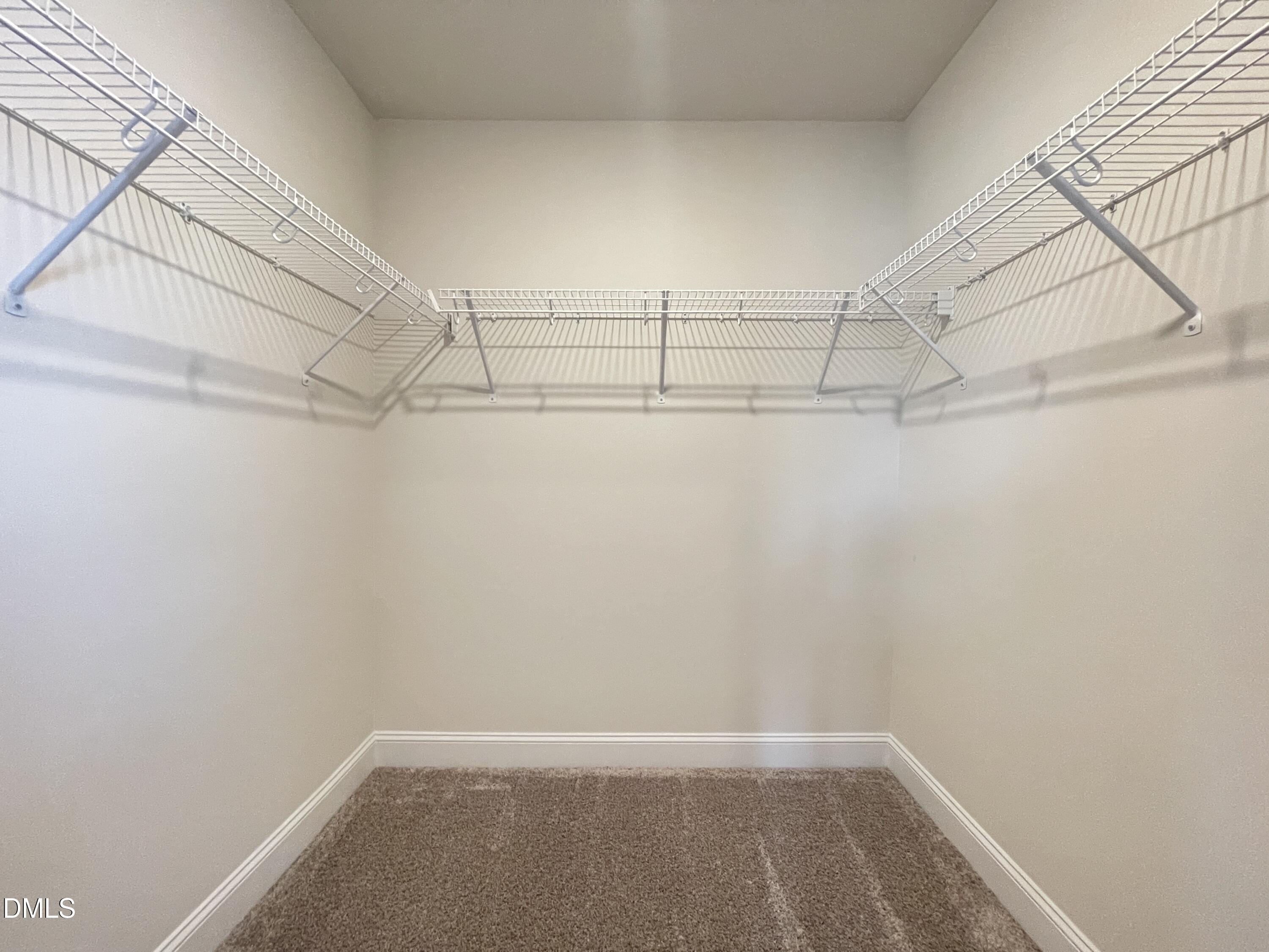 6911 Outfall Point Lane Raleigh, NC 27616 - Photo 31 of 34 a view of a room with racks on the wall
