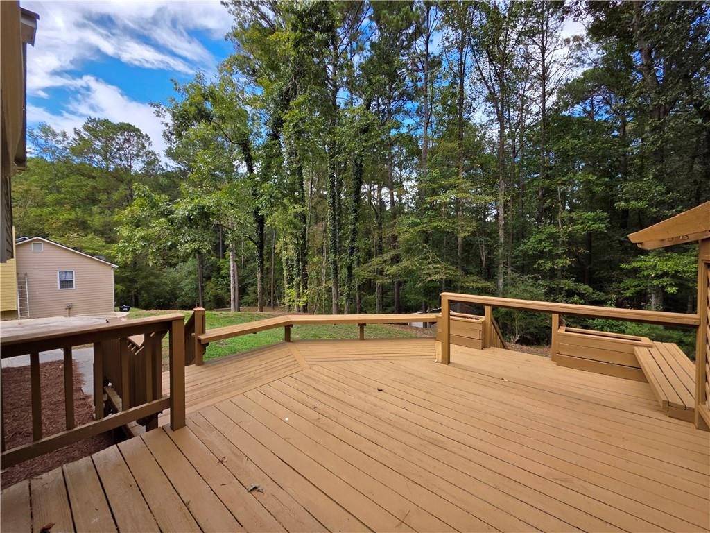 570 Remington Lane Acworth, GA 30101 - Photo 18 of 20 a view of a terrace with wooden floor and outdoor seating