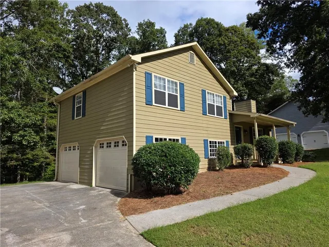 a view of a yard in front view of a house