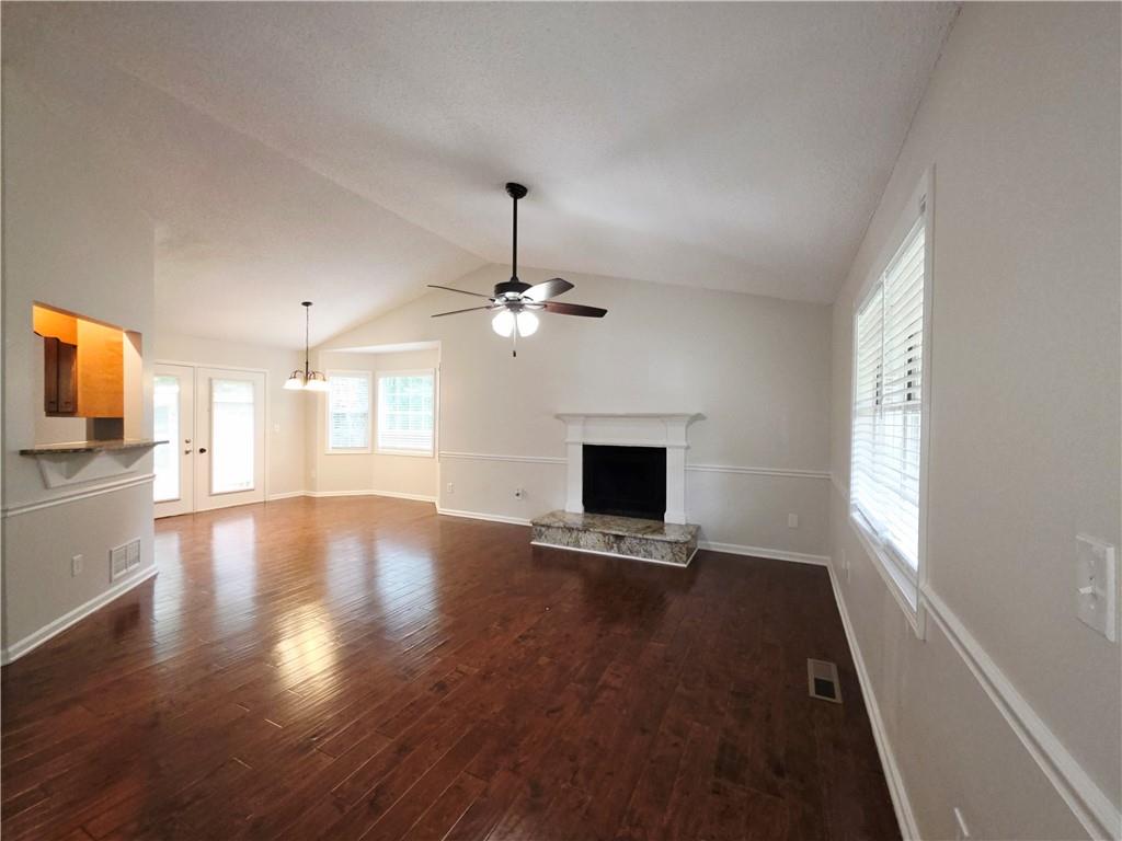 570 Remington Lane Acworth, GA 30101 - Photo 4 of 20 a view of an empty room with wooden floor and a window