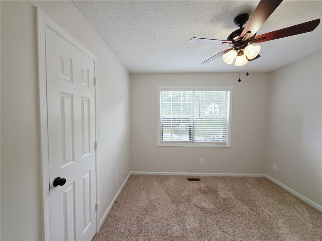 570 Remington Lane Acworth, GA 30101 - Photo 7 of 20 a view of an empty room with a window