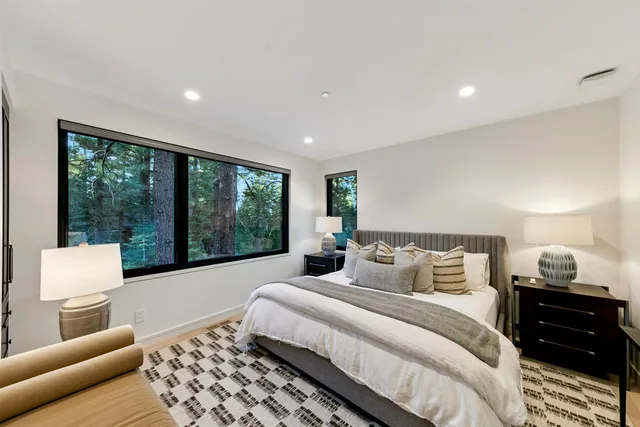 a bedroom with a bed and a couch